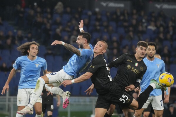 Lazio's Taty Castellanos, left, and Napoli's Leo Ostigard vie for the ball during the Serie A soccer match between Lazio and Napoli at Rome's Olympic Stadium, Sunday, Jan. 28, 2024. (AP Photo/Gregorio Borgia)