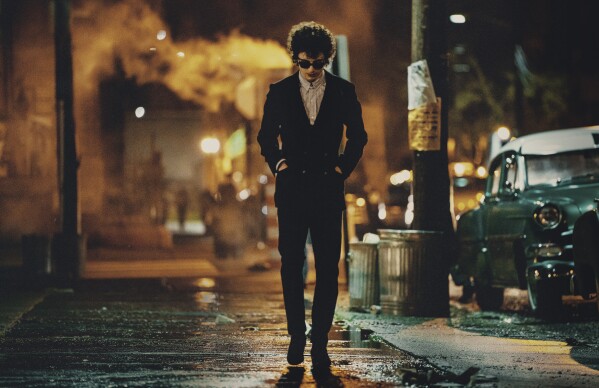 This image released by Searchlight Pictures shows Timothée Chalamet in a scene from "A Complete Unknown." (Macall Polay/Searchlight Pictures via AP)
