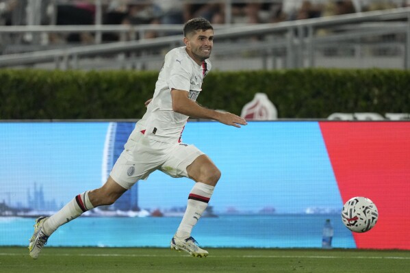 AC Milan forward Christian Pulisic (11) runs after the ball during a Soccer Champions Tour exhibition match against Real Madrid FC, Sunday, July 23, 2023, in Pasadena, Calif. (AP Photo/Ashley Landis)