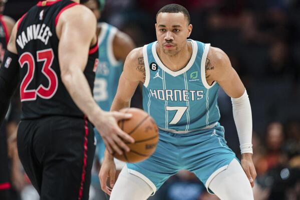 Charlotte Hornets guard Bryce McGowens (7) guards Toronto Raptors guard Fred VanVleet (23) during the first half of an NBA basketball game in Charlotte, N.C., Tuesday, April 4, 2023. (AP Photo/Jacob Kupferman)