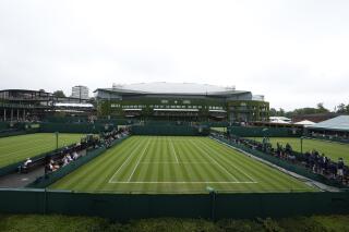 FILE -The outside courts in front of Centre Court are shown on day one of the Wimbledon Tennis Championships in London, Monday June 28, 2021. How much do you know about Wimbledon? (AP Photo/Kirsty Wigglesworth, File)