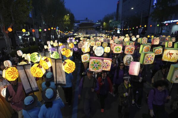Participants march during the Yeon Deung Hoe, or Lotus Lantern Festival, ahead of the Buddha's birthday on May 5, in downtown Seoul, South Korea, Saturday, April 26, 2025. (AP Photo/Lee Jin-man)