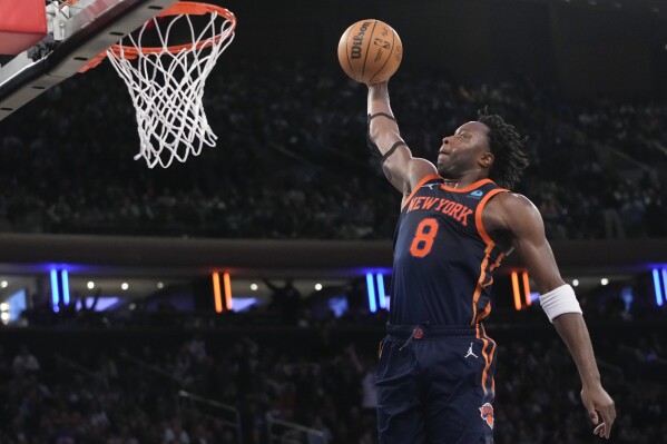 New York Knicks forward OG Anunoby dunks against the Philadelphia 76ers during the second half of an NBA basketball game Tuesday, March 12, 2024, at Madison Square Garden in New York. (AP Photo/Mary Altaffer)
