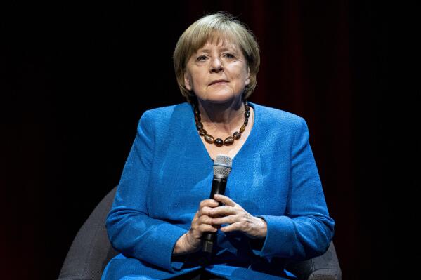 Former German Chancellor Angela Merkel answers questions from journalist and author Alexander Osang under the theme "So what is my country?" at the Berliner Ensemble in Berlin, Germany, Tuesday, June 7, 2022. (Fabian Sommer/dpa via AP)