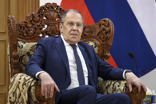 In this handout photo released by the Russian Foreign Ministry Press Service, Russian Foreign Minister Sergey Lavrov poses for a photo prior to his talks with Myanmar Foreign Minister Wunna Maung Lwin in Naypyitaw, Myanmar, Wednesday, Aug. 3, 2022. (Russian Foreign Ministry Press Service via AP)