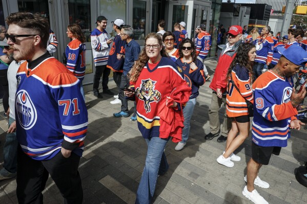 A Florida Panthers fan arrives for Game 4 of the NHL hockey Stanley Cup Final between the Panthers and the Edmonton Oilers, Saturday, June 15, 2024, in Edmonton, Alberta. (Jeff McIntosh/The Canadian Press via AP)