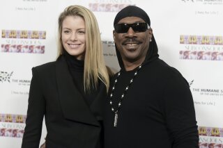 
              FILE - In this Nov. 20, 2016, file photo, Paige Butcher, left, and Eddie Murphy attend "SUBCONSCIOUS" by Bria Murphy Gallery Opening at Lace Gallery in Los Angeles. Murphy and his fiancee Butcher have a new baby boy. The couple released a statement through Murphy’s publicist Monday, Dec. 3, 2018, saying Max Charles Murphy was born Friday, Nov. 30 and weighed 6 pounds, 11 ounces. (Photo by Richard Shotwell/Invision/AP, File)
            