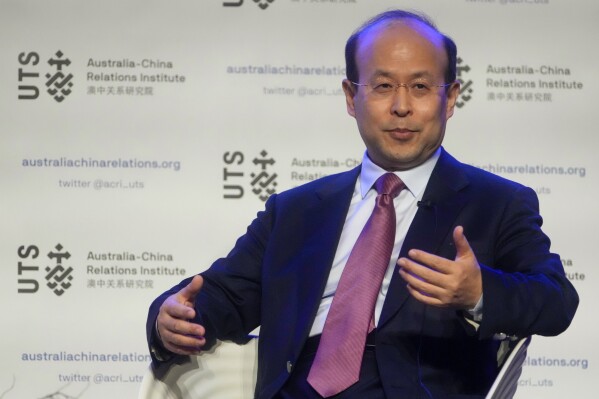 FILE - China's Ambassador to Australia, Xiao Qian gestures as he answers following his address on the state of relations between Australia and China at the University of Technology in Sydney, Australia, June 24, 2022. Xiao on Thursday, Sept. 28, 2023, criticized Australian politicians who visit Taiwan, saying they are being utilized by separatists on the self-governing island. (AP Photo/Mark Baker, FILE)