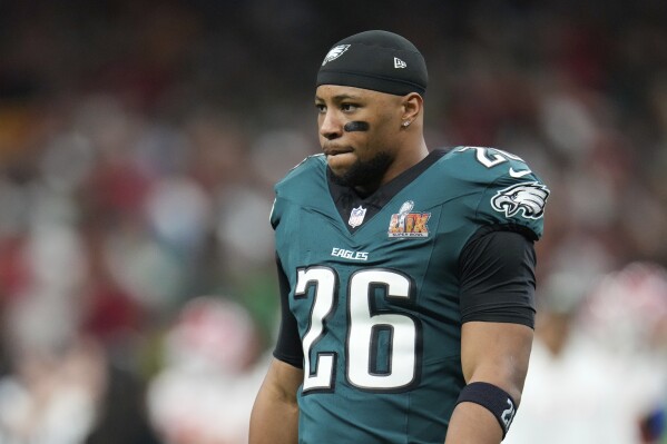 Philadelphia Eagles running back Saquon Barkley (26) walks on the field before the NFL Super Bowl 59 football game against the Kansas City Chiefs, Sunday, Feb. 9, 2025, in New Orleans. (AP Photo/George Walker IV)
