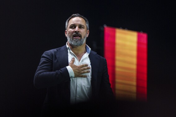 Santiago Abascal, leader of the far right VOX party gestures as he delivers a speech on stage during the Spanish far-right wing party Vox's rally "Europa Viva 24" in Madrid, Spain, Sunday, May 19, 2024. VOX has invited speakers from across the right wing spectrum including Marine Le Pen, Viktor Orban and Argentine President Javier Milei who has been visiting Spain since Friday. (AP Photo/Manu Fernandez)