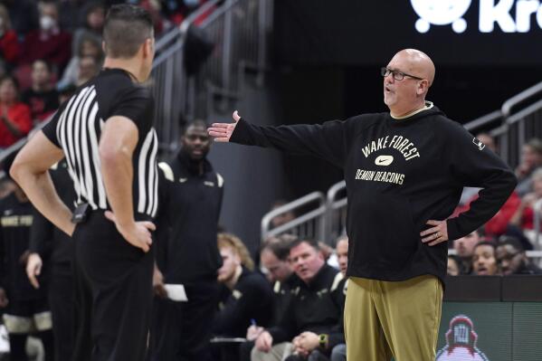 Wake Forest head coach Steve Forbes argues a call with a game official during the second half of an NCAA college basketball game against Louisville in Louisville, Ky., Wednesday, Dec. 29, 2021. Louisville won 73-69. (AP Photo/Timothy D. Easley)