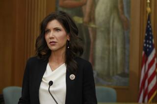 South Dakota Gov. Kristi Noem announces on Monday, June 22, 2020, that city and county governments will be able to access federal coronavirus relief funds as she speaks at the Sioux Falls city hall in Sioux Falls, S.D. (AP Photo/Stephen Groves)