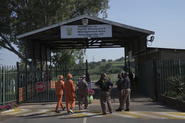 K-9 officers gather at the entrance of Atteridgeville Prison where Oscar Pistorius is being held, ahead of a parole hearing in Pretoria, South Africa, Friday, Nov. 24, 2023. (AP Photo/ Tsvangirayi Mukwazhi)