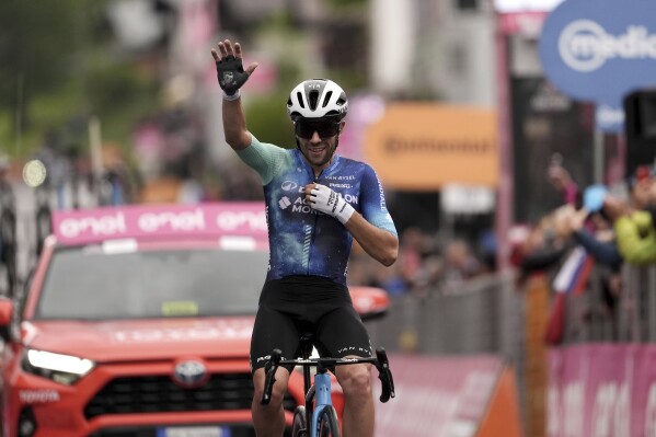 Italy's Andrea Vendrame celebrates winning the 19th stage of the Giro d'Italia cycling race from Mortegliano to Sappada, Italy, Friday, May 24, 2024. (Massimo Paolone/LaPresse via AP)