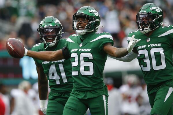 New York Jets' Brandin Echols, center, celebrates his interception during the first half of an NFL football game against the Tampa Bay Buccaneers, Sunday, Jan. 2, 2022, in East Rutherford, N.J. (AP Photo/John Munson)