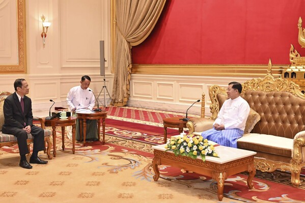 In this photo released from Myanmar Military True News Information Team, Min Aung Hlaing, right, the head of ruling military council, talks with Alounkeo Kittikhoun, left, special envoy of ASEAN Chairman, during their meeting Wednesday, Jan. 10, 2024, in Naypyitaw, Myanmar. A veteran Laotian diplomat recently appointed the Association of Southeast Asian Nations' special envoy to Myanmar, has arrived on his first mission to the strife-torn nation. (The Military True News Information Team via AP)