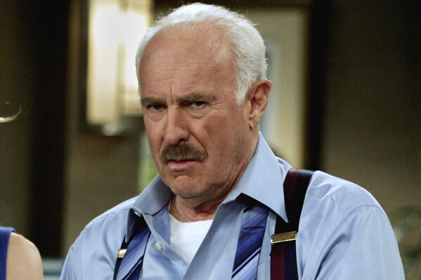 FILE - Dabney Coleman appears on the set of "Courting Alex" at Warner Bros. studios in Burbank, Calif., on Jan. 25, 2006. Coleman, the mustachioed character actor who specialized in smarmy villains like the chauvinist boss in "9 to 5" and the nasty TV director in "Tootsie," died Thursday, May 16, 2024, his daughter, Quincy Coleman, told The Hollywood Reporter. He was 92. No other details were immediately available. (AP Photo/Reed Saxon, File)