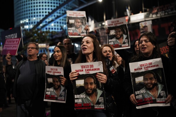 FILE - Relatives and supporters of the Israeli hostages held in the Gaza Strip by the Hamas militant group attend a rally calling for their release, in Tel Aviv, Israel, on March 16, 2024. Fears are rising that time is running out for hostages in Gaza that are still alive. Nearly eight months later, there are 43 hostages whose remains are being held by Gaza militants and roughly 80 who have not been declared dead. (AP Photo/Ohad Zwigenberg, File)