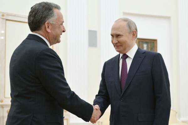 Russian President Vladimir Putin, right, and U.S. President Donald Trump's special envoy Steve Witkoff greet each other prior to their talks at the Kremlin in Moscow, Russia, Friday, April 25, 2025. (Kristina Kormilitsyna, Sputnik, Kremlin Pool Photo via AP)