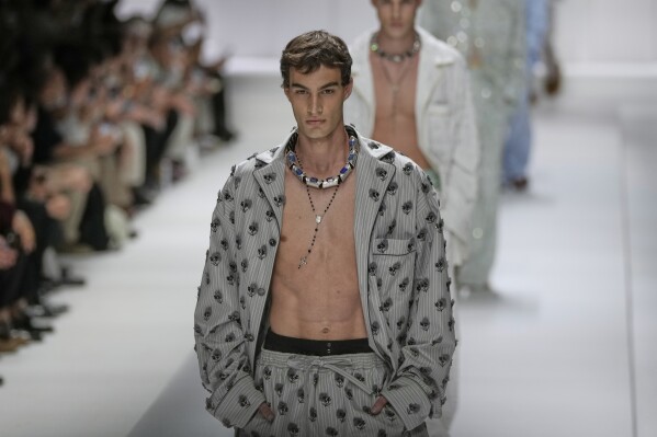 A model wears a creation as part of the men's Dolce & Gabbana Spring-Summer 2026 collection, that was presented in Milan, Italy, Saturday, June 21, 2025. (AP Photo/Luca Bruno)