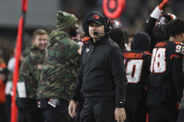 Oregon State head coach Jonathan Smith looks at the scoreboard during the second half of an NCAA college football game against Stanford Saturday, Nov. 11, 2023, in Corvallis, Ore. Oregon State won 62-17. (AP Photo/Amanda Loman)