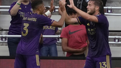 Orlando City's Duncan McGuire (13) celebrates his goal against Toronto FC with Rafael Santos (3) during the first half of an MLS soccer match Tuesday, July 4, 2023, in Orlando, Fla. (AP Photo/John Raoux)