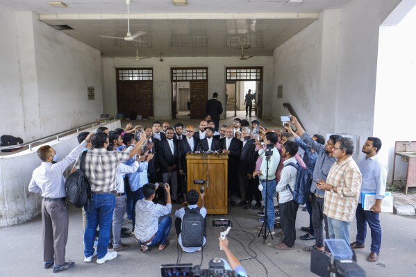 Bangladesh's largest Islamist party Jamaat-e-Islami's lawyer Matiur Rahman Akanda, addresses journalists after Bangladesh's highest court dismissed their appeal seeking overturn of a previous High Court decision cancelling its registration with the Election Commission in Dhaka, Bangladesh, Sunday, Nov.19, 2023. The decision means Bangladesh Jamaat-e-Islami party is not eligible to contest any polls as a party. Bangladesh will hold its next national elections on Jan. 7. (AP Photo/Mahmud Hossain Opu)