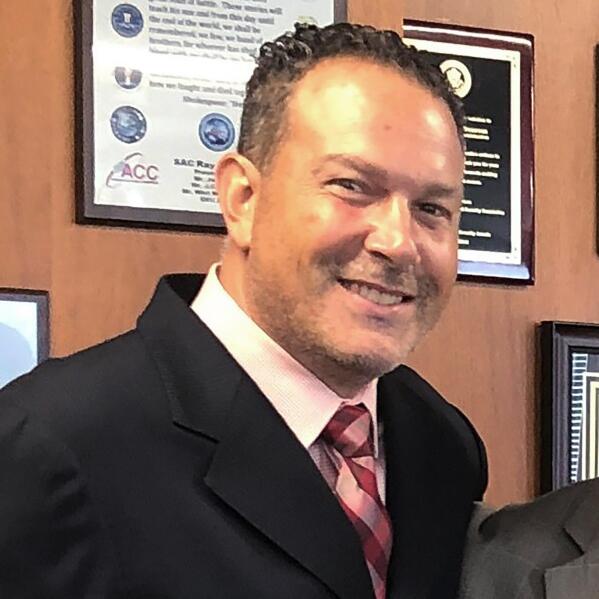 This portion of a photo posted on Twitter by the DEA's New York division on Aug 30, 2019 shows Nicholas Palmeri. The U.S. Drug Enforcement Administration quietly removed Palmeri, its top official in Mexico, in 2022 over improper contact with lawyers for narcotraffickers, an embarrassing end to a brief tenure marked by deteriorating cooperation between the countries and a record flow of cocaine, heroin and fentanyl across the border. (DEA via AP)