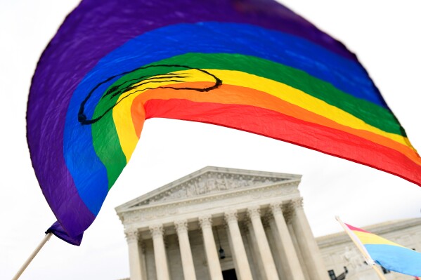 People gather outside the Supreme Court in Washington, Oct. 8, 2019. (AP Photo/Susan Walsh, File)