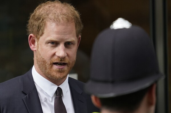 FILE - Prince Harry leaves the High Court after giving evidence in London, Tuesday, June 6, 2023. Prince Harry is challenging on Tuesday, Dec. 5, 2023, the British government’s decision to strip him of his security detail after he gave up his status as a working member of the royal family and moved to the United States. The Duke of Sussex said he wants protection when he visits home and claimed it's partly because an aggressive press jeopardizes his safety and that of his family. (AP Photo/Alberto Pezzali, File)