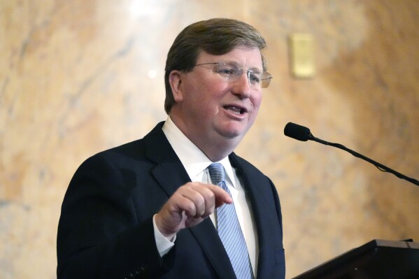 FILE - Mississippi Republican Gov. Tate Reeves delivers his State of the State address to the Mississippi State Legislature, Feb. 26, 2024, at the state Capitol in Jackson, Miss. Reeves has signed a new law Tuesday, March 12, that will allow women to receive Medicaid coverage earlier in pregnancy. (AP Photo/Rogelio V. Solis, File)