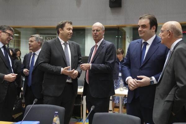 From left, Italy's Finance Minister Giancarlo Giorgetti, President of the Eurogroup Paschal Donohoe, Germany's Finance Minister Lars Klingbeil, French Finance Minister Eric Lombard, Greek Economy Minister Kyriakos Pierrakakis and Cypriot Finance Minister Makis Keravnos during a meeting of eurogroup finance ministers at the European Council building in Brussels, Monday, May 12, 2025. (AP Photo/Virginia Mayo)