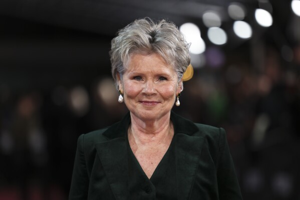 Imelda Staunton poses for photographers upon arrival at the premiere for 'The Crown' season 6 finale, in London, Tuesday, Dec. 5, 2023. (Photo by Vianney Le Caer/Invision/AP)