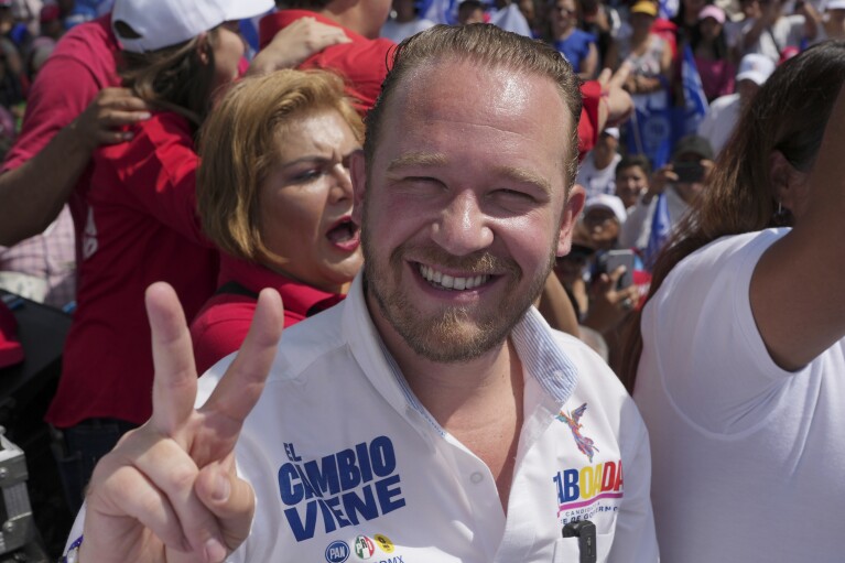Mayoral candidate Santiago Taboada flashes hand sign during his closing campaign rally in Mexico City, Saturday, May 25, 2024.  (AP Photo/Marco Ugarte)