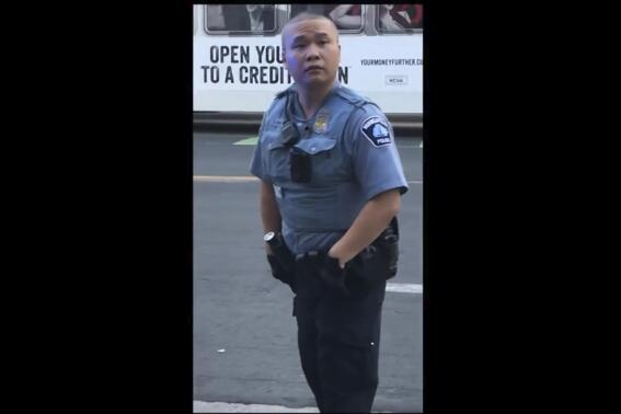 In this screen grab from video, former Minneapolis police officer Tou Thao appears at the scene where George Floyd died at the hands of former police officer Derek Chauvin, on May 25, 2020, in Minneapolis, Minn. The concept of willfulness will be key to a verdict at the federal trial of Thao and two other police officers accused of violating George Floyd's rights almost two years ago as Officer Derek Chauvin pressed his knee into the Black man's neck. (Court TV, via AP, Pool)