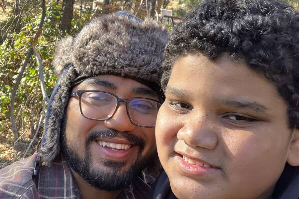This undated image provided by Mikel Desmond shows him with his younger brother Marcus, who turned up in Deming, N.M., on Tuesday, Feb. 27, 2024, after going missing from his family's home in Tucson, Ariz. Authorities in New Mexico posted a photograph of the 13-year-old with autism on social media and were able to identify him with help from the public and Tucson police. He was back home with his family on Wednesday. (Mikel Desmond via AP)