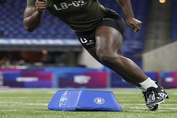 FILE - Alabama linebacker Will Anderson runs a drill at the NFL football scouting combine in Indianapolis, March 2, 2023. This draft class is deep at both edge rusher and corner, though the top tier at those two positions might be a little light on star prospects — outside of Anderson. (AP Photo/Michael Conroy, File)