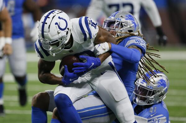 Detroit Lions offense huddles against Indianapolis Colts during an NFL  preseason football game, …