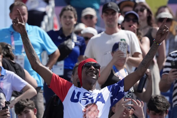 US artist Snoop Dogg attends a women's beach volleyball match between The United States and France at the 2024 Summer Olympics, Wednesday, July 31, 2024, in Paris, France. (AP Photo/Robert F. Bukaty)