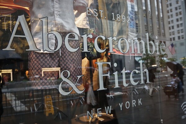 FILE - In this May 22, 2017, file photo, a store window reflects a street scene at an Abercrombie & Fitch store on New York's Fifth Avenue. A former model for Abercrombie & Fitch has sued the fashion retailer, Friday, Oct. 27, 2023, alleging it allowed its former CEO Mike Jeffries to run a sex-trafficking organization during his 22-year tenure.(AP Photo/Bebeto Matthews, File)