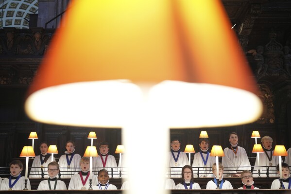 The Choristers of St Paul's choir, including girls for first time in 900-year history, rehearse for the Christmas services in St Paul's Cathedral, in London, Monday, Dec. 23 2024. (AP Photo/Kin Cheung)
