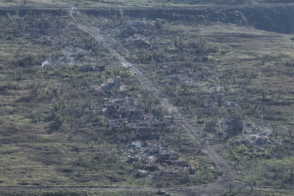 That image was taken from a drone on Wednesday Sept. 6, 2023, Houses are seen destroyed during the fighting between Russian and Ukrainian armed forces are seen in Andriivka, Donetsk region, Ukraine. (AP Photo/Evgeniy Maloletka)