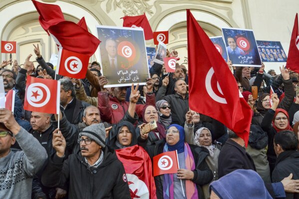 People take part in a protest against president Kais Saied policies, in Tunis, Tunisia, Sunday, March 5, 2023. (AP Photo/Hassene Dridi, File)