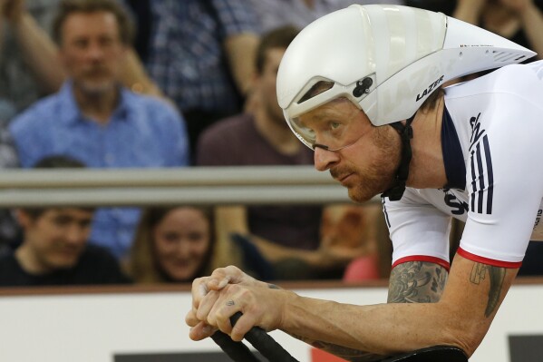 Britain's Bradley Wiggins, looks across at the clock as he waits to start in the Men's Team Pursuit round 1 at the World Track Cycling championships in London, on March 3, 2016. (AP Photo/Alastair Grant, File)