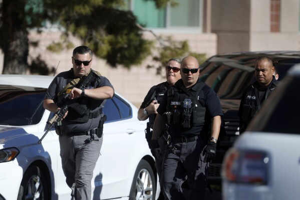 Nevada State Police officers head onto the University of Nevada, Las Vegas, campus after reports of an active shooter, Wednesday, Dec. 6, 2023, in Las Vegas. (Steve Marcus/Las Vegas Sun via AP)