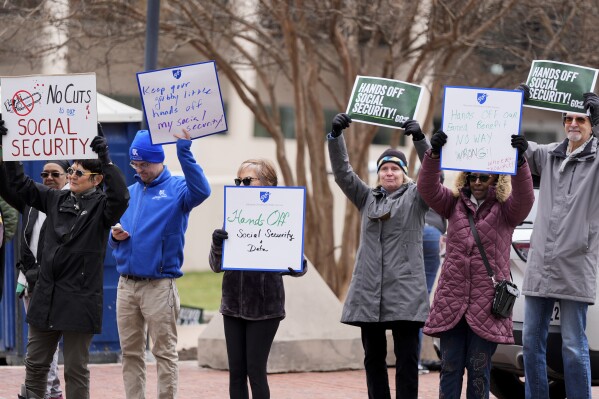 Demonstrators gather outside of the Edward A. Garmatz United States District Courthouse in Baltimore, on Friday, March 14, 2025, before a hearing regarding the Department of Government Efficiency&#x27;s access to Social Security data. (AP Photo/Stephanie Scarbrough, File)