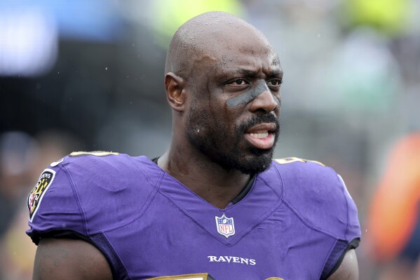 FILE - Baltimore Ravens linebacker Justin Houston (50) is shown before an NFL football game against the New York Jets on Sunday, Sep. 11, 2022, in East Rutherford, N.J. The Panthers feel the addition of four-time Pro Bowl outside linebacker Justin Houston — who once had 22 sacks in a season — will help Panthers' Brian Burns maximize his potential as the team transitions to a 3-4 defensive scheme under new coordinator Ejiro Evero. (AP Photo/Brad Penner, File)
