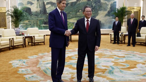 U.S. Special Presidential Envoy for Climate John Kerry, left, and Chinese Premier Li Qiang shake hands before a meeting at the Great Hall of the People in Beijing Tuesday, July 18, 2023. (Florence Lo/Pool Photo via AP)