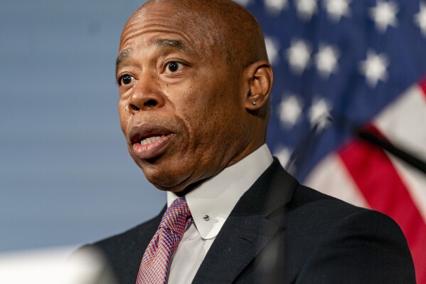 FILE - New York City Mayor Eric Adams speaks during a news conference at City Hall in New York, Dec. 12, 2023. Adams told reporters at a press conference Monday, Jan. 8, 2024, that a dramatic story from his own book – in which he recounted mistakenly firing a gun at a school as a child – was not true. He also said he was moving to pull the book from circulation after learning that it was erroneously published more than a decade ago. (AP Photo/Peter K. Afriyie, File)