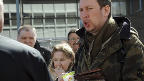 FILE - Paavo Arhinmaki, right, then leader of The Left Alliance and candidate for the Finnish Parliament, meets with voters during the party's election campaign in Helsinki, Finland, Saturday April 16, 2011. The current deputy mayor of Finland’s capital Arhinmaki is facing possible legal action, and calls for him to pay compensation for damages and to resign, after he was caught red-handed spray-painting graffiti in a railway tunnel on Friday, June 23, 2023. (Sari Gustafsson/Lehtikuva via AP, File)